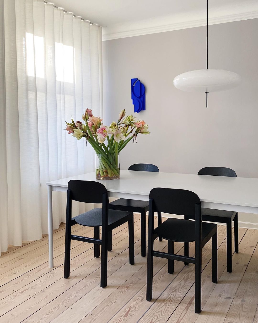 Minimalist Elliptical Pendant Light with Vertical Rod