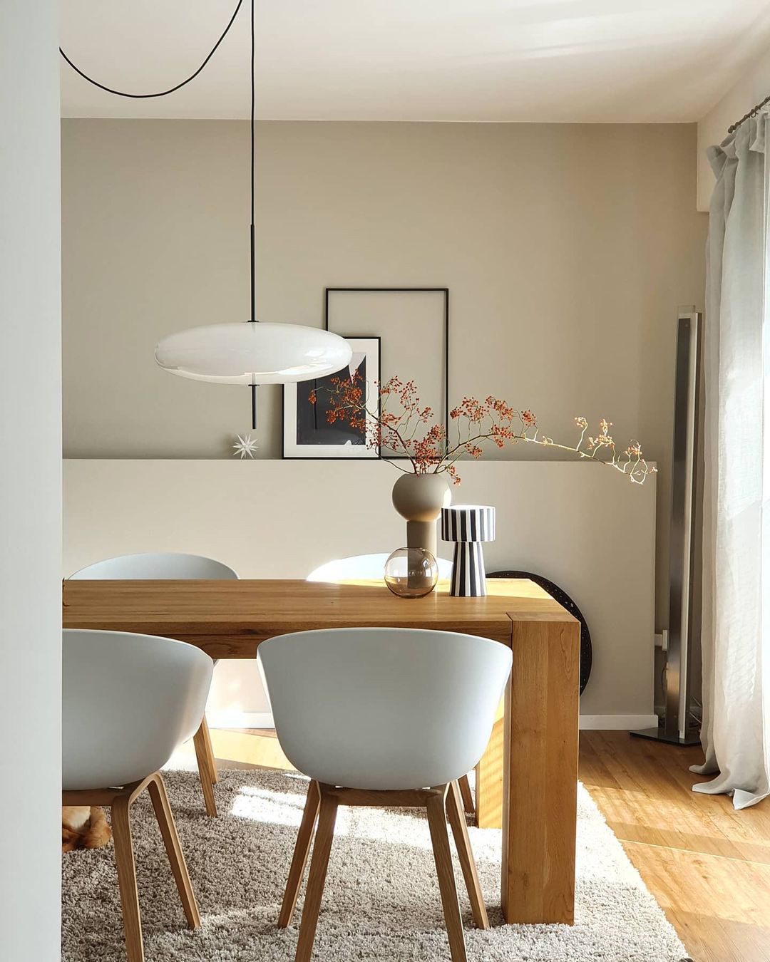 Minimalist Elliptical Pendant Light with Vertical Rod