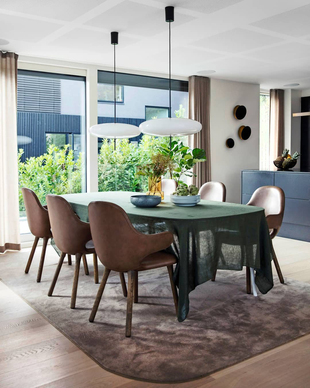 Minimalist Elliptical Pendant Light with Vertical Rod