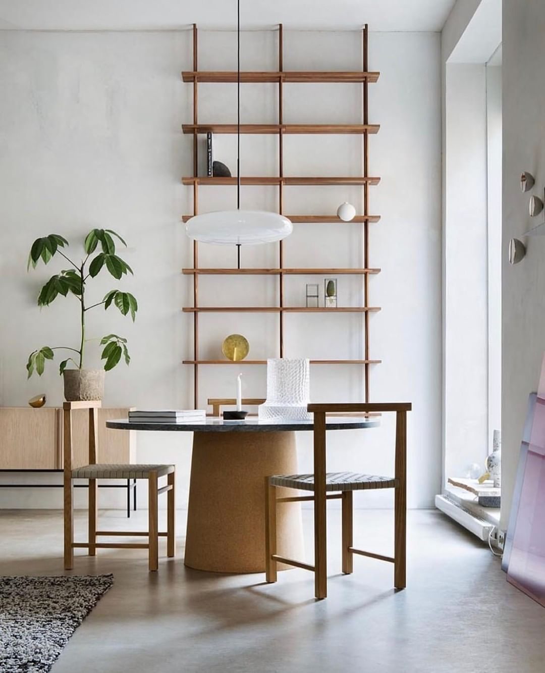 Minimalist Elliptical Pendant Light with Vertical Rod