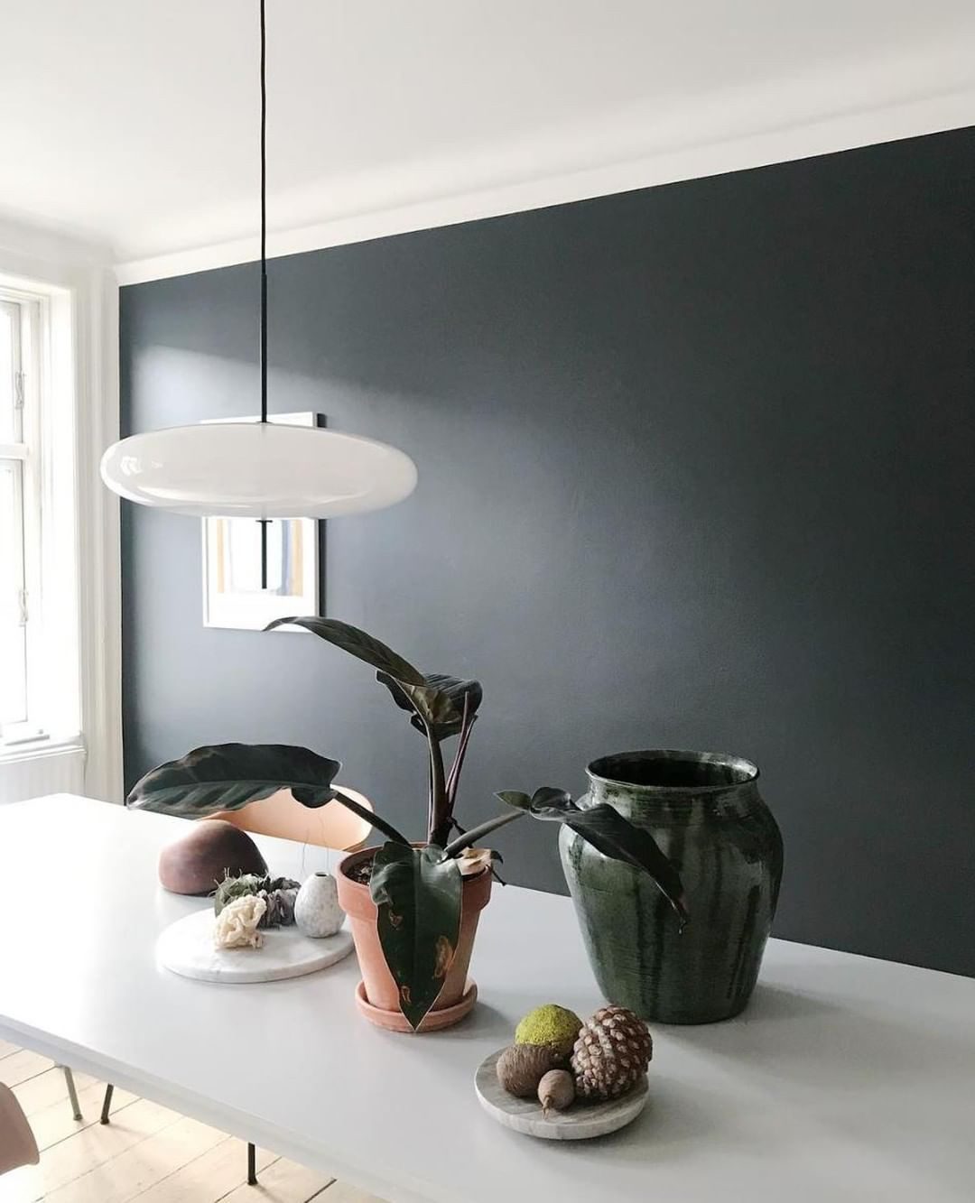 Minimalist Elliptical Pendant Light with Vertical Rod