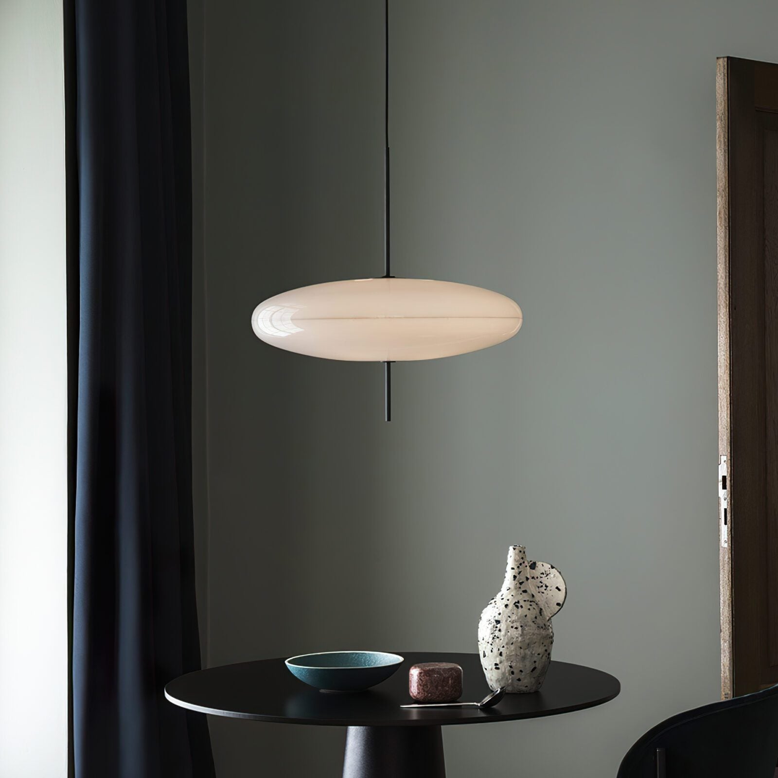 Minimalist Elliptical Pendant Light with Vertical Rod