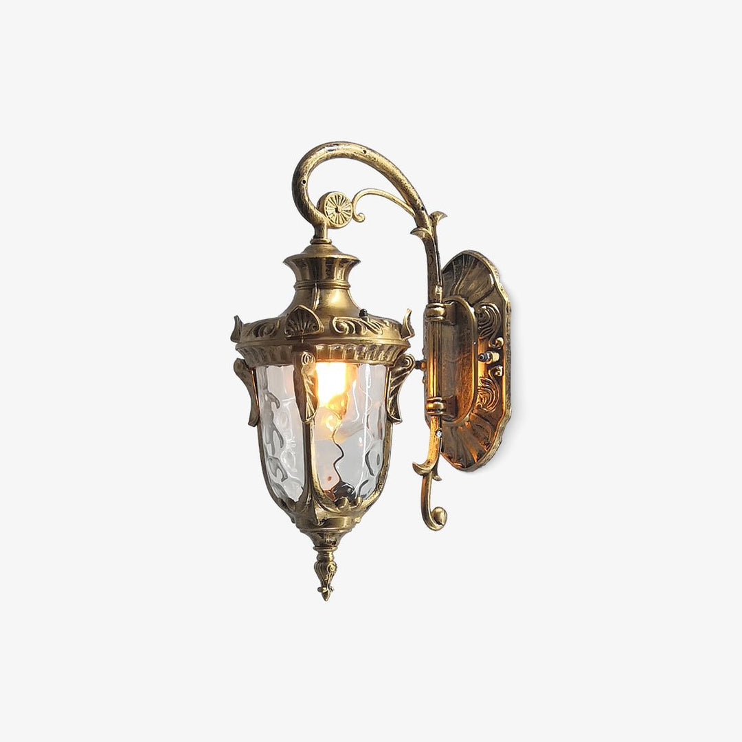Elegant vintage brass outdoor wall lantern with antique detailing and waterproof design. Perfect for adding a timeless touch to gardens, patios, or porches. LED compatible for energy-efficient outdoor lighting.