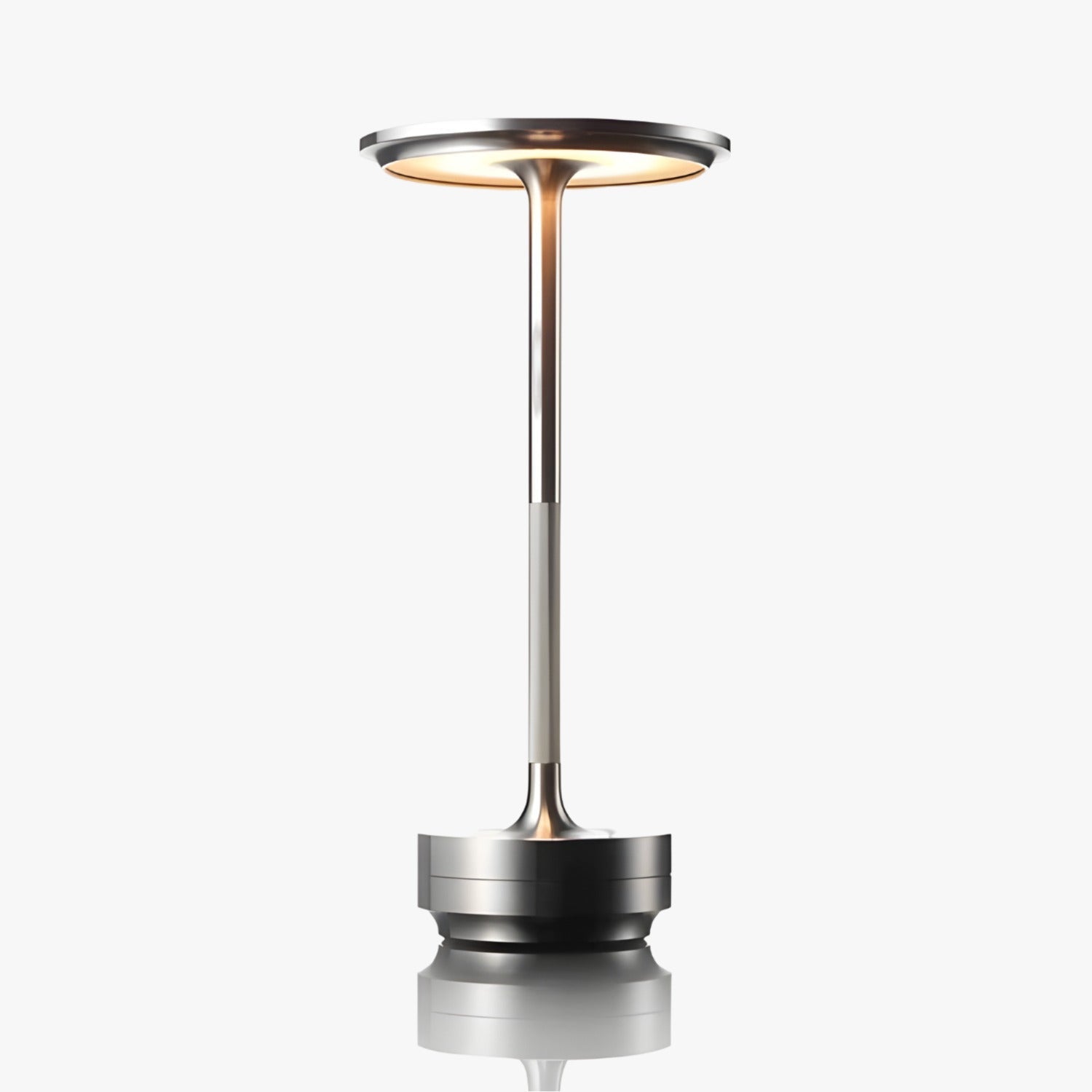 Sleek silver cordless table lamp illuminated, showcasing its modern and minimalistic design.