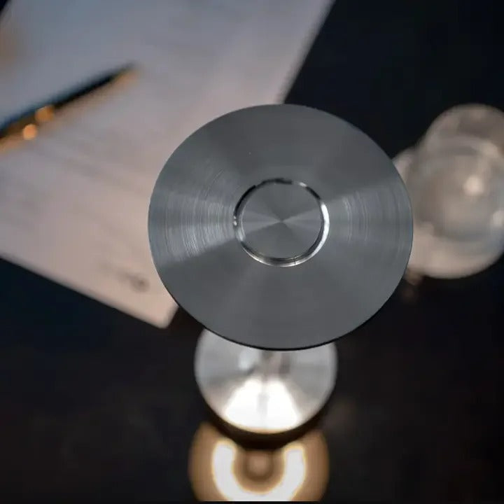 Top view of a sleek, modern cordless table lamp with brushed metal finish, perfect for office or study settings.