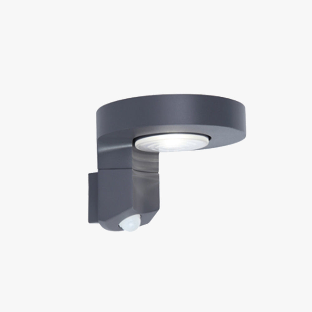 Modern round solar-powered outdoor wall lamp with a black metal and acrylic design. Waterproof and rustproof with a built-in sensor, ideal for gardens, patios, and staircases.

