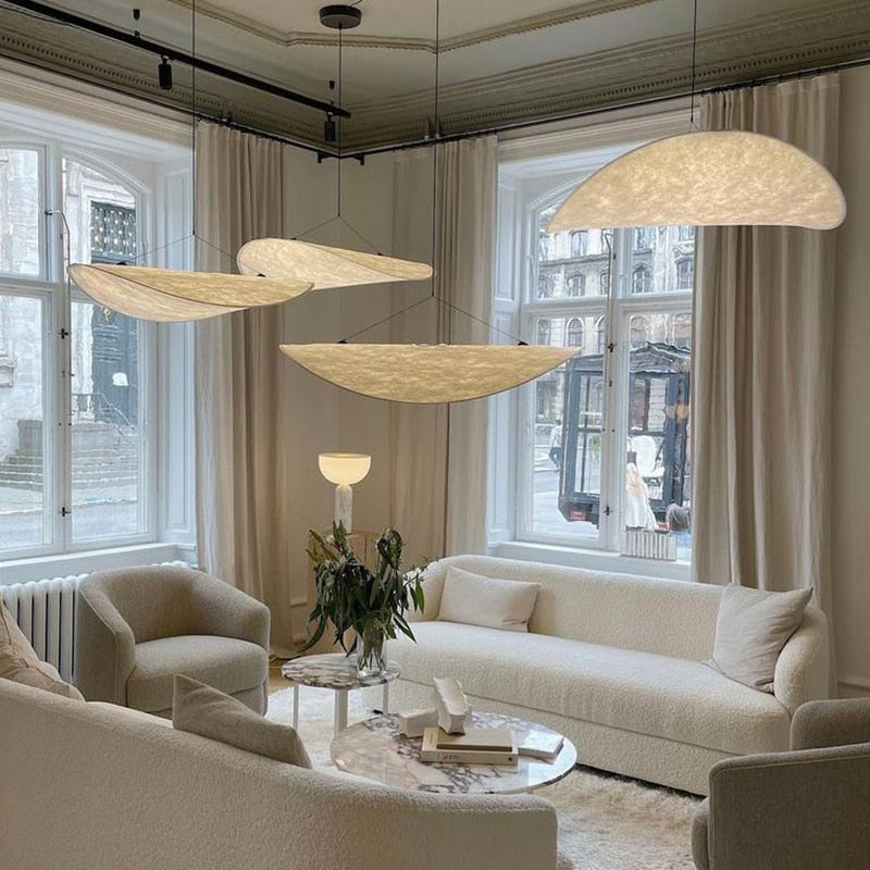 Cluster of CloudGlo LED Pendant Lights creating a cozy atmosphere in a modern living room.