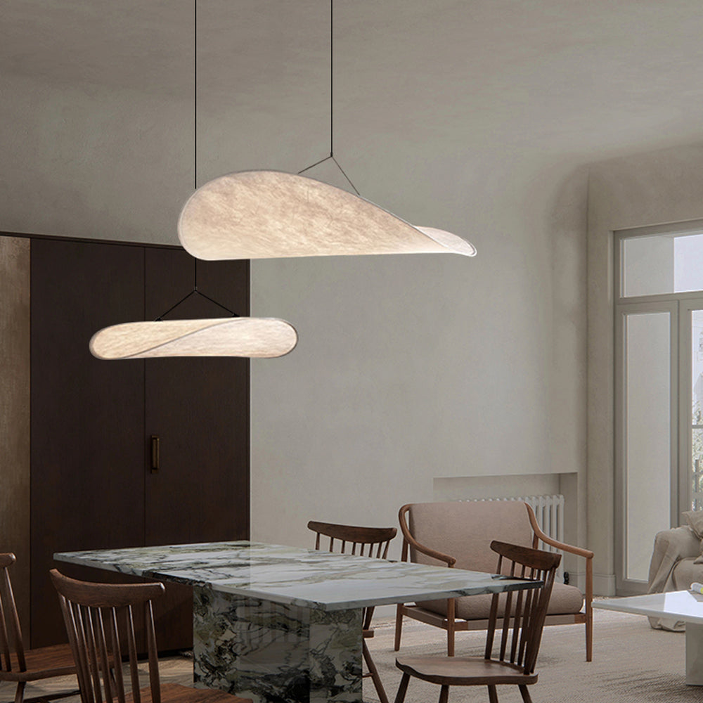 CloudGlo LED Pendant Light illuminating a dining area with its elegant, cloud-shaped design, providing a warm and inviting atmosphere.