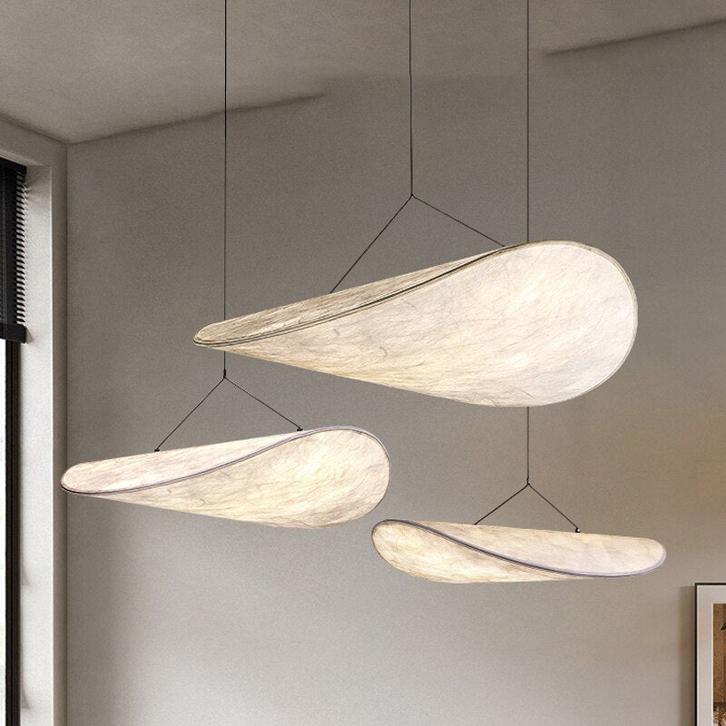 Trio of CloudGlo LED Pendant Lights hanging in a contemporary setting, providing soft and diffused lighting.